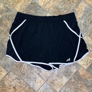 bcg 1X running shorts with liner. Black and white. NWOT. Excellent condition.